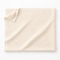 Naya Baby organic cotton cellular baby blanket OEKO-TEX cream flat lay white surface