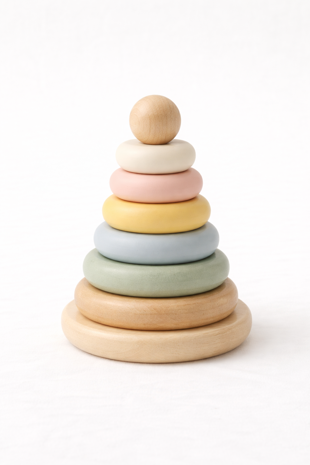Naya Baby wooden baby stacking rings Montessori toy rainbow coloured white background